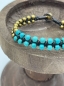 Preview: Armband mit türkis- und goldfarbenen Perlen und schwarzen Kordeln "Georgina"
